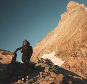 Jornet as seen from behind as he moves toward the east face of Matterhorn in the morning sun