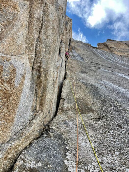 a climber on a crack at a granite big wall