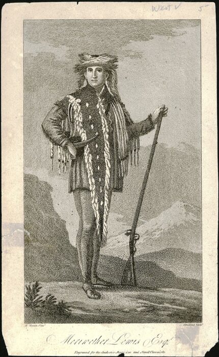 a white man in Native garb holding a rifle 