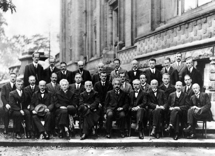 a group of scientists in a black and white photo