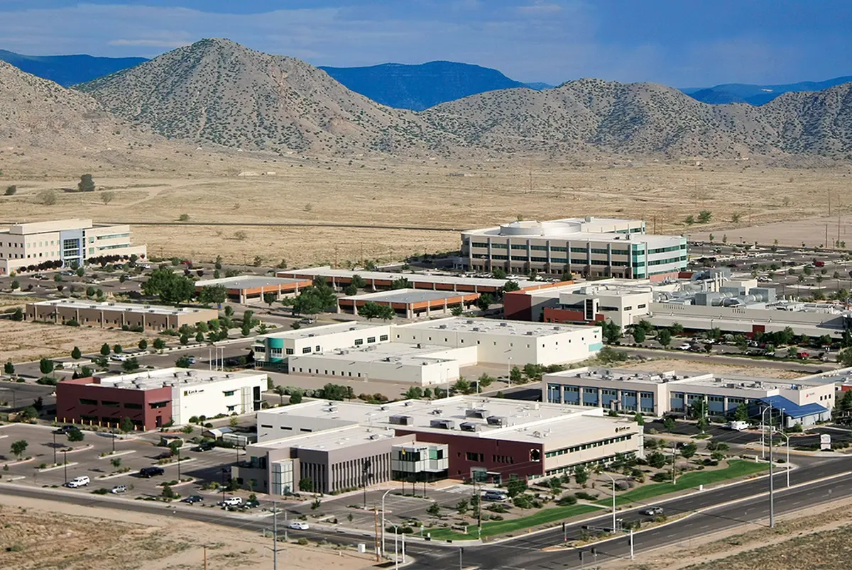 The Science and Technology Park at Sandia National Laboratories sit in the desert beneath bare mountains.