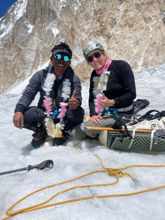 The climbers squatting on the snow