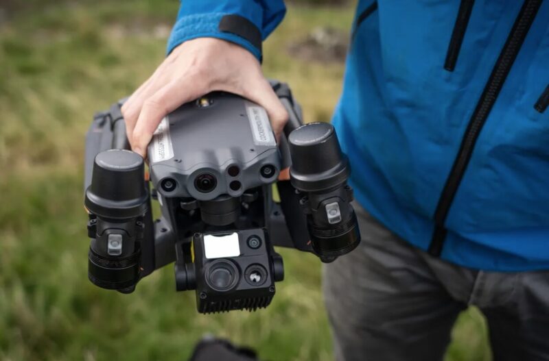 A man holds a drone.