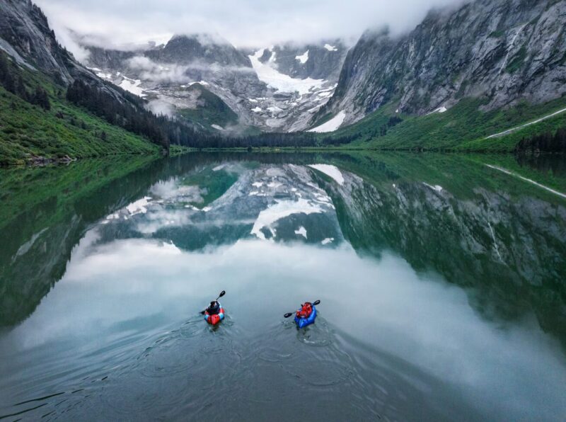 Honnold and Caldwell paddle on Alaska's Scenery Lake.