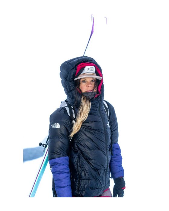 Christina Lustenberger carrying her skis