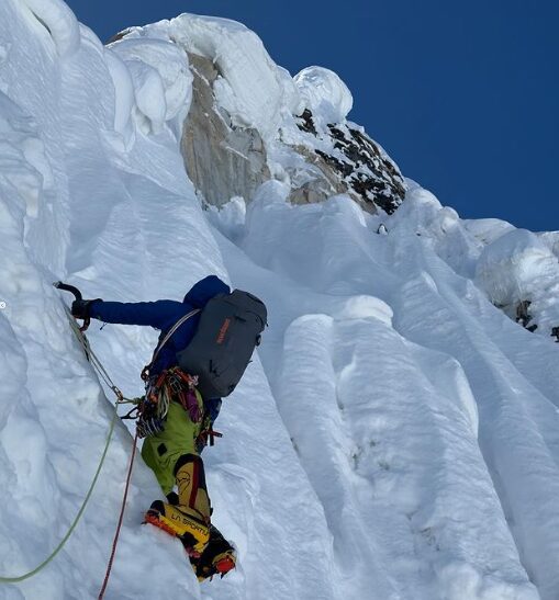 A climber on nearly vertical ice formations