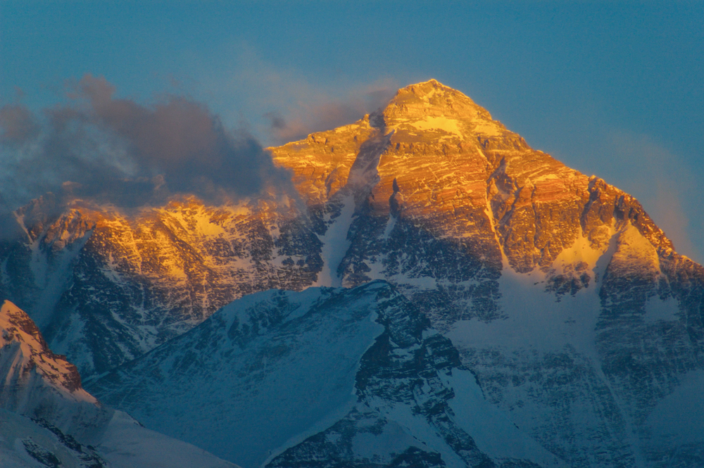 Everest at sunset, the upper part of the north side lit up.