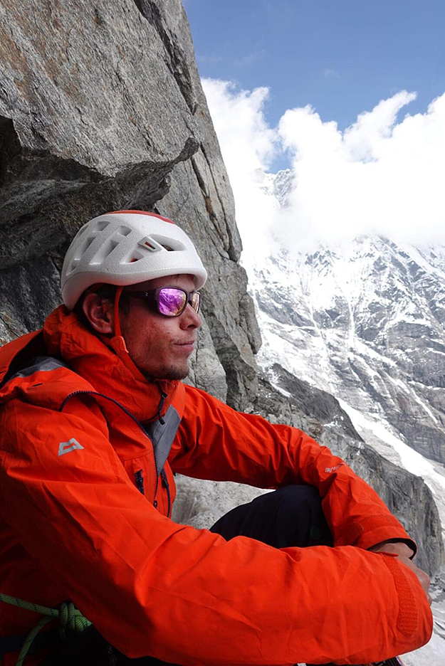 Ondra stares at the horizon from the bivouac under the East face of Langtang Lirung