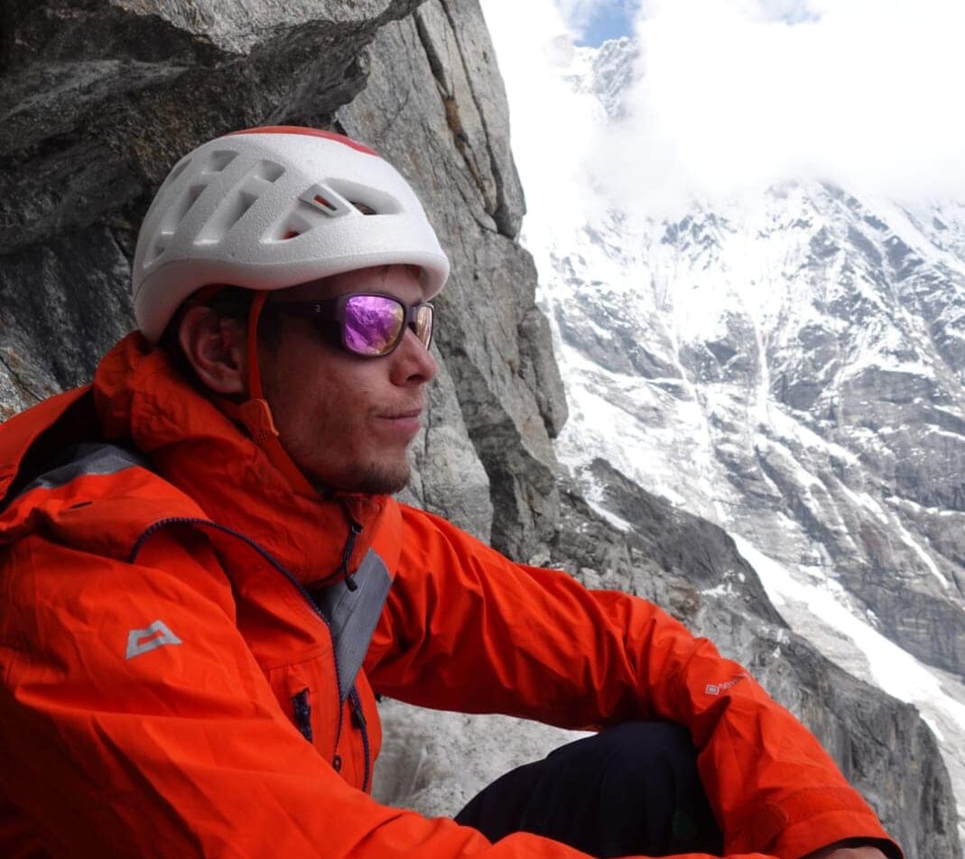 Ondra stares at the horizon from the bivouac under the East face of Langtang Lirung