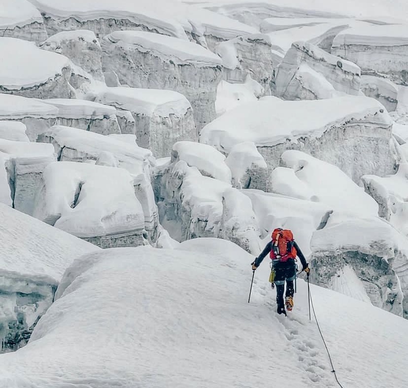 Crossing the crevassed glacier to the head of the southeastern wall of the unclimbed Atta'niz Sar in the Hunza Valley.