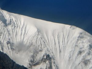 The snowy summit ridge of Langtang Lirung as seem from Ghompa village