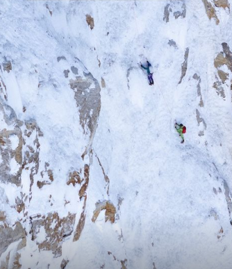 the climbers on vertical ice/snow terrain