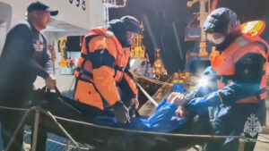 a man his hauled into a boat via stretcher