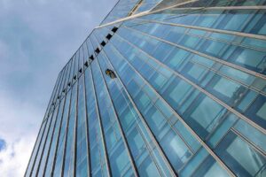 man climbing skyscraper