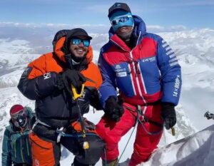 Purja and Mingma G stepping together on the summit of Shisha Pangma