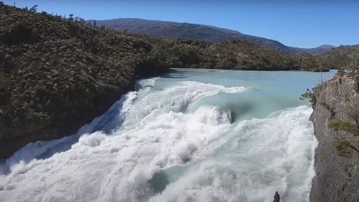 a huge rapid in a blue river