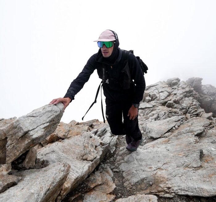 Jornet on a ridge of rocky slabs