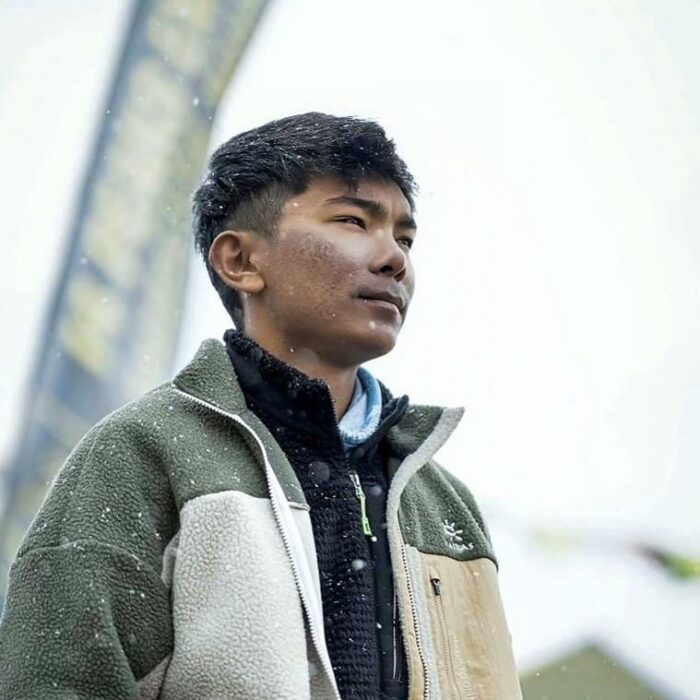 Close shot of Nima Rinji Sherpa in a base camp during a foggy day