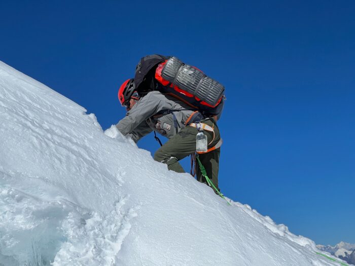 Russian climber climbing in deep snow