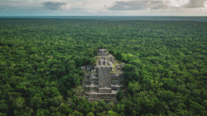 ancient Mayan pyramid in jungle from the air