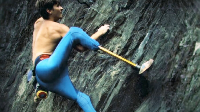 a man climbs with prosthetic limbs