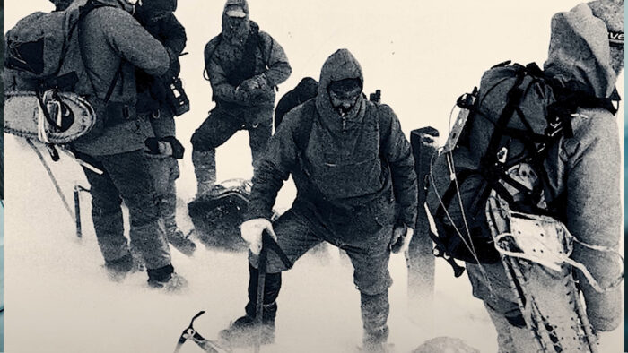 a group of people standing in the snow in the aftermath of an avalanche