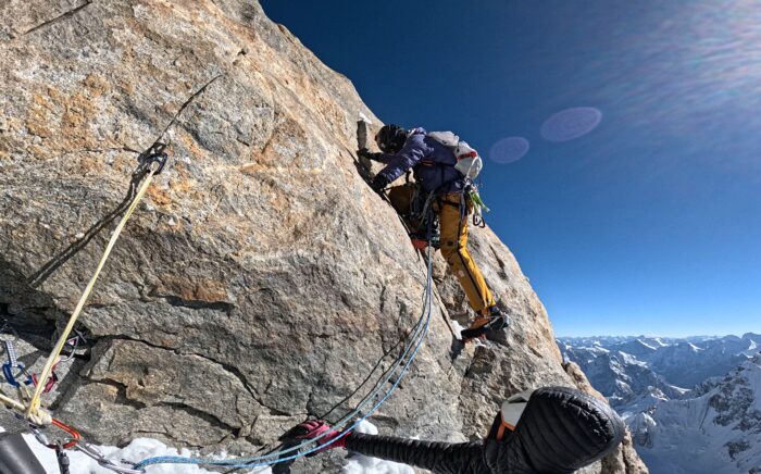 Climber on difficult rock section at 6,400m