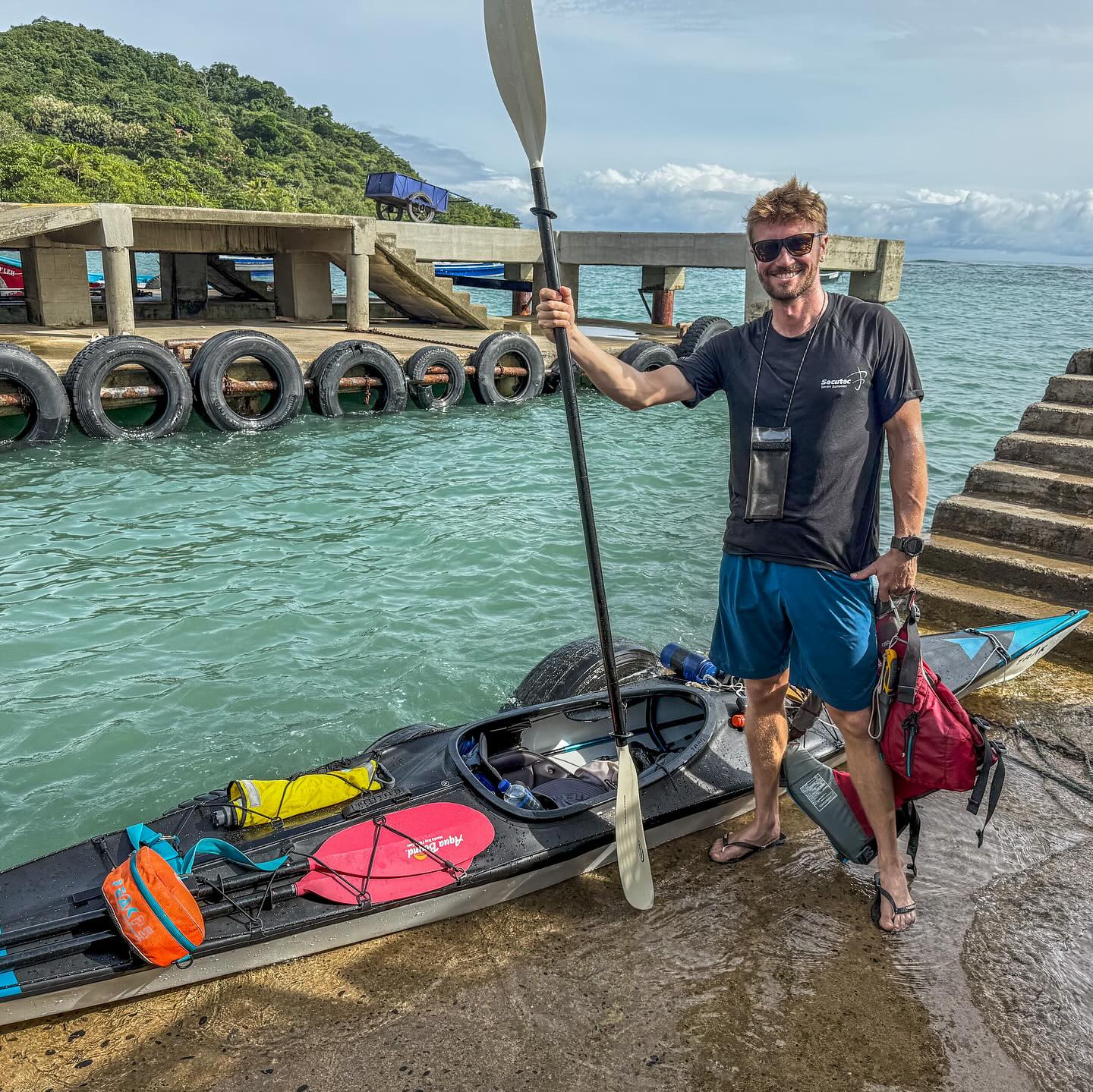 kayaker standing with paddle