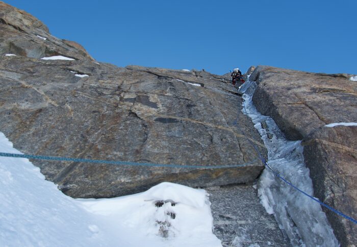 A climber on a thin line of ice