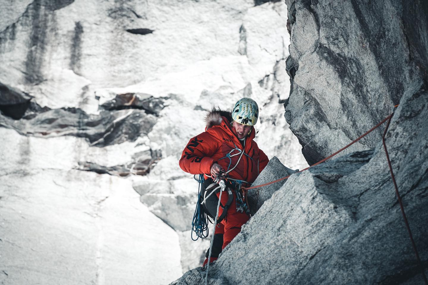 Kobusch in winter dawn suit on a rocky section of Everest.