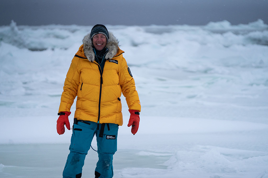 larsen in yellow parka in polar ice scene