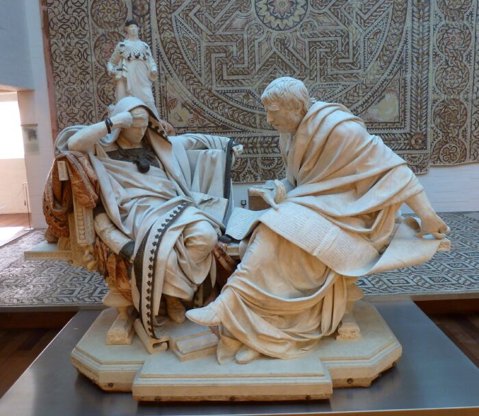 a sculpture of two men