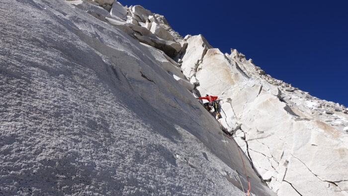 the climber on a smooth slab on Shivling