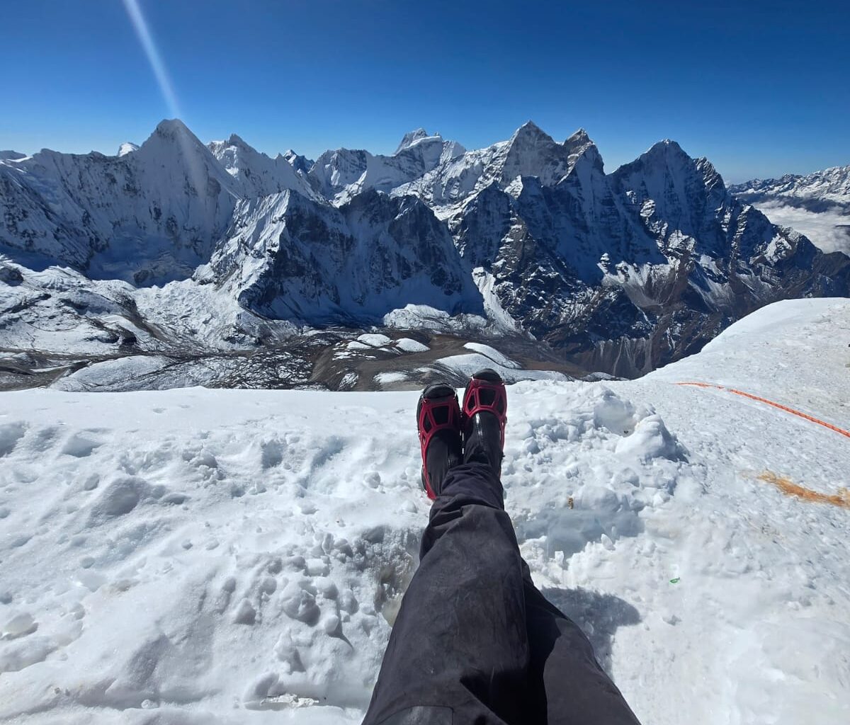 Andrews' feet with light boots and microspikes at camp 3 on Ama Dablam.