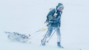 a man hauls a sled