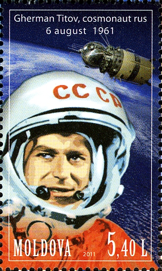 A vintage Soviet stamp with a man in an astronaut helmet.