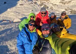 The clmbers take a selfie in Base Camp on Kimshung