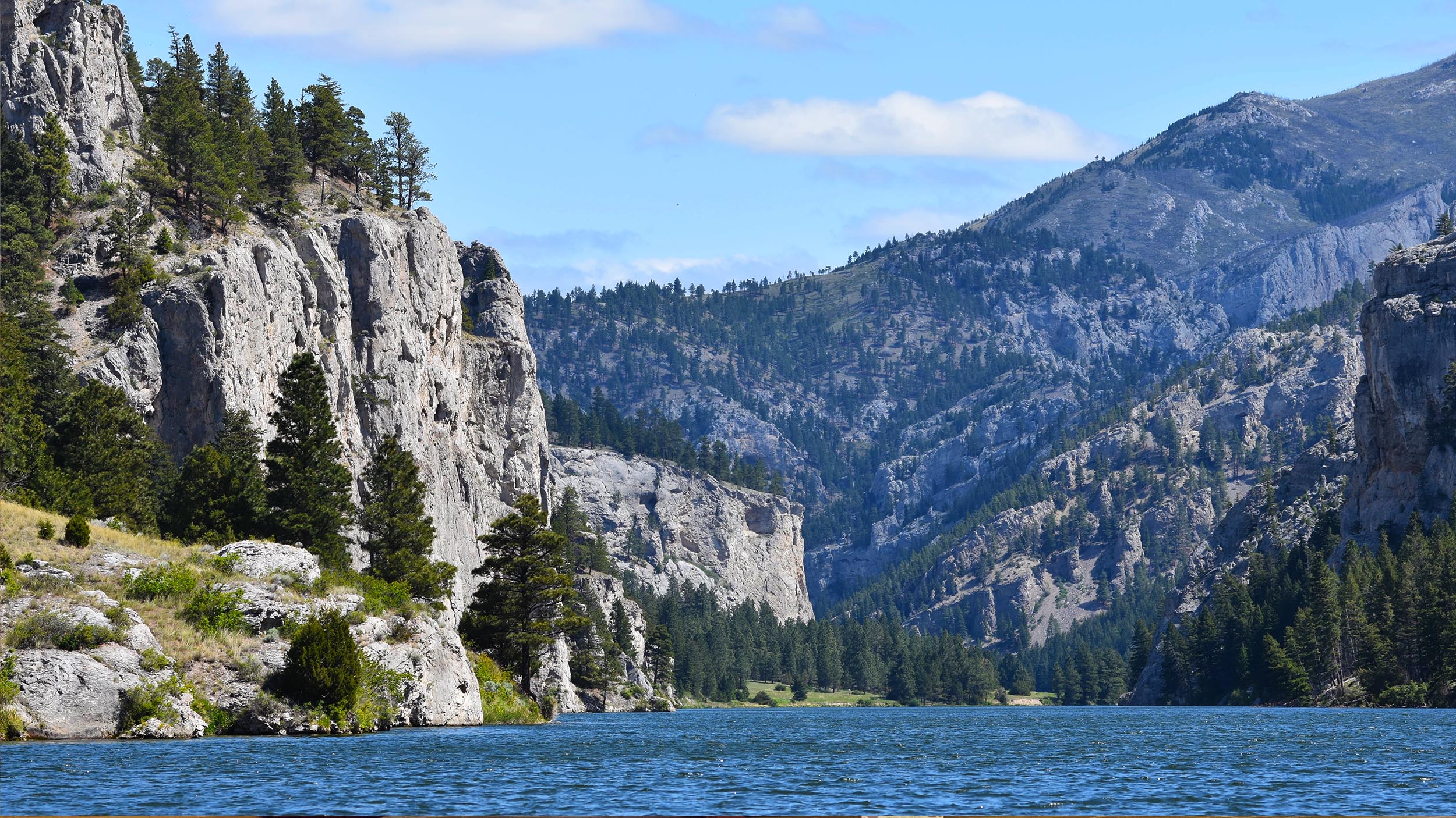 a view of mountains from the Missouri River.