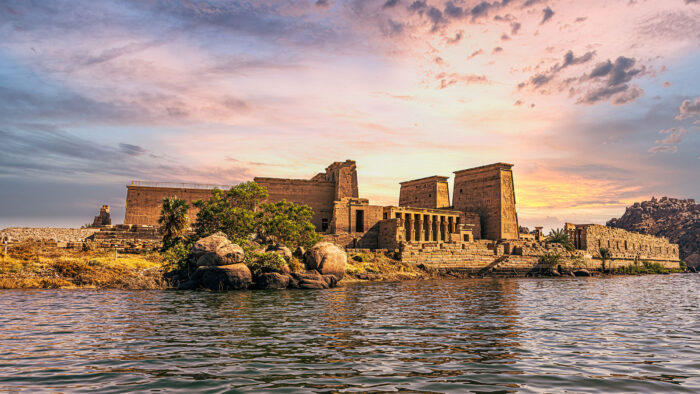 an egyptian temple on the banks of a river