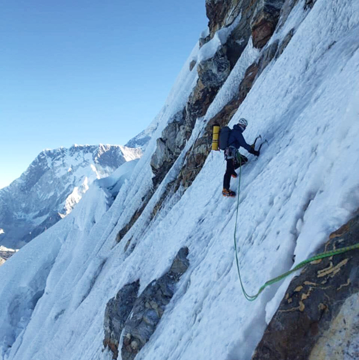 climber traversing a steep ramp