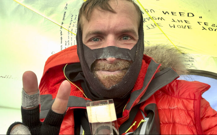 A tired-looking Vincent Colliard in camp in Antarctica.