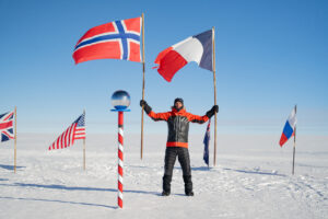 Vincent Colliard at the South Pole flags