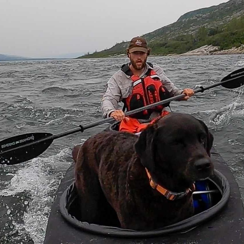 canoeist and dog