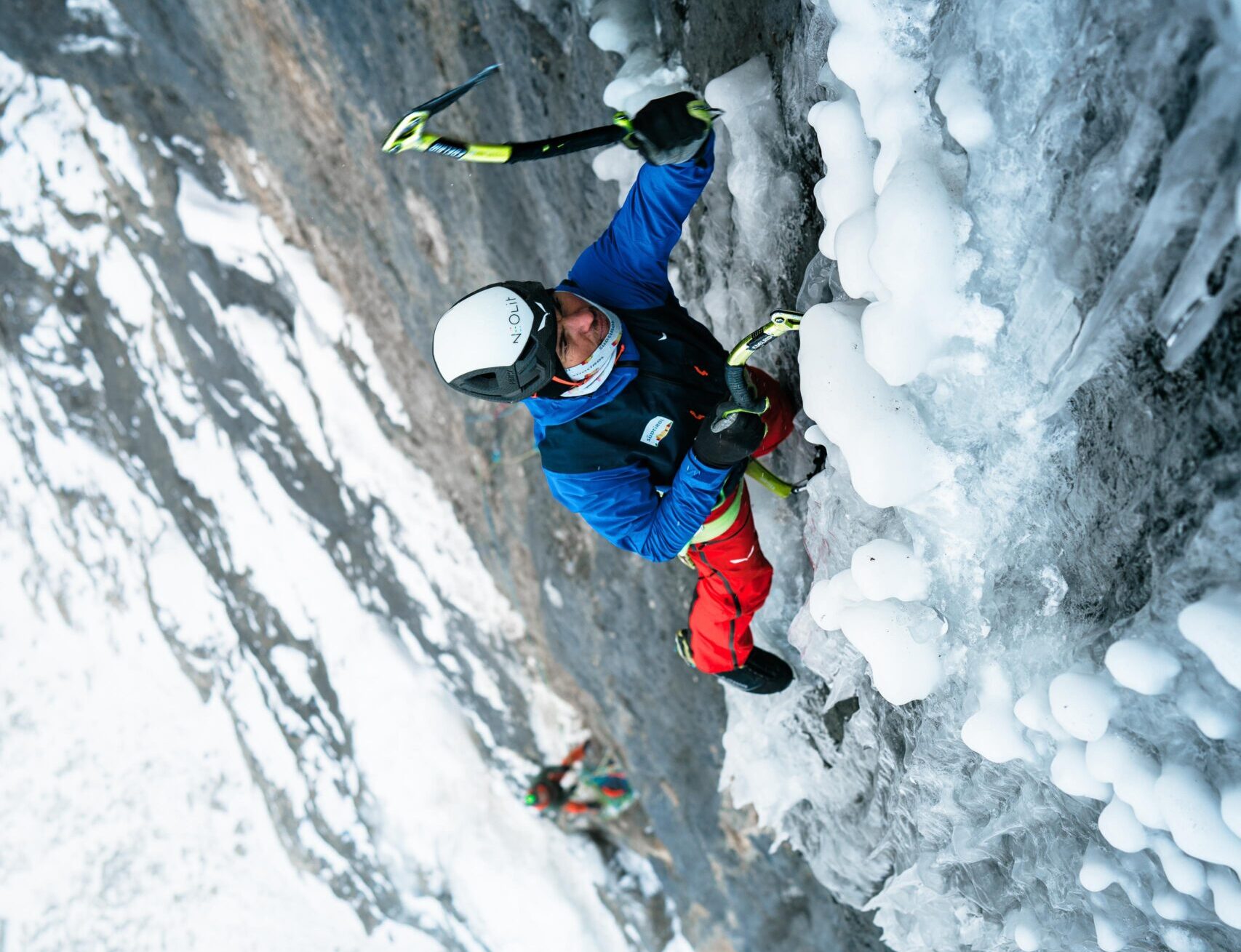 The climber on a vertical, mixed wall