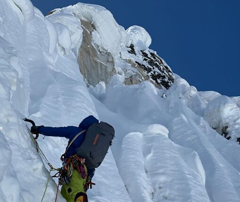 a climber on vertical ice