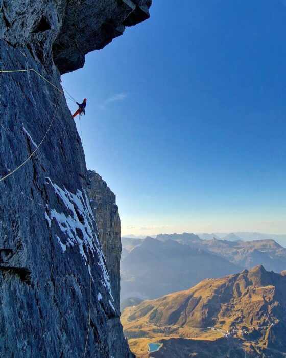 A climber on a traversing pitch on the North face of Eiger. 