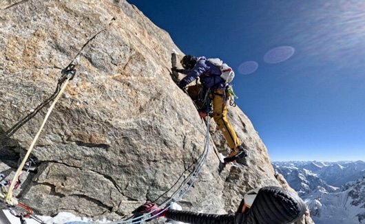 Yudai Suzuki follows the hard rock flakes and connects his line to the final ice wall on Thui II.