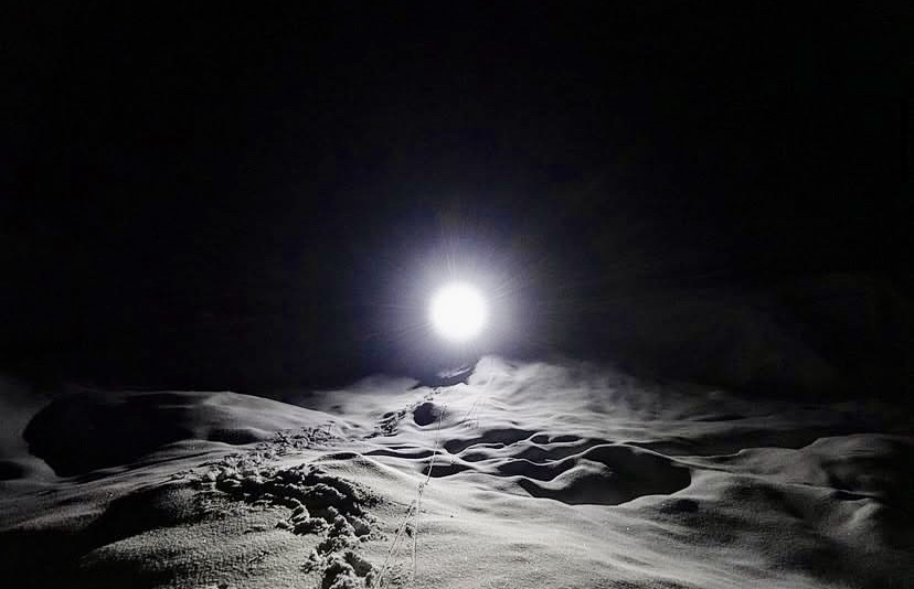 Descending from 6,000m to Base Camp through a crevassed glacier at night.