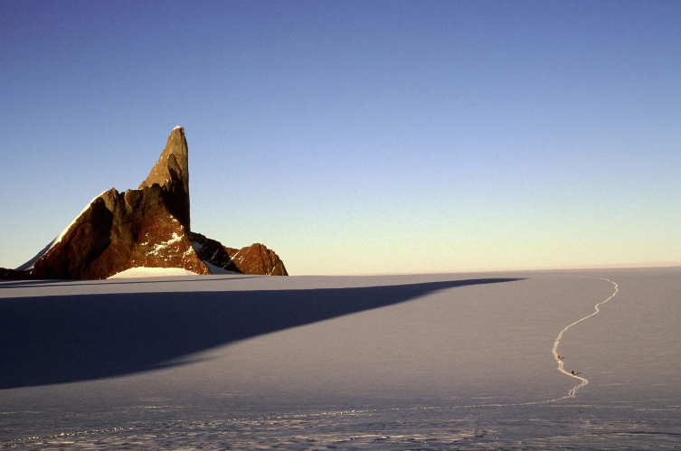 Alex Lowe, Conrad Anker and Gordon Wiltsie skiing toward Rakekniven in Queen Maud Land, Antarctica.