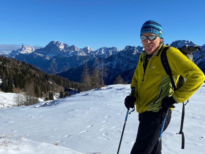 Corominas with sun glases and beaniein the Dolomites in winter